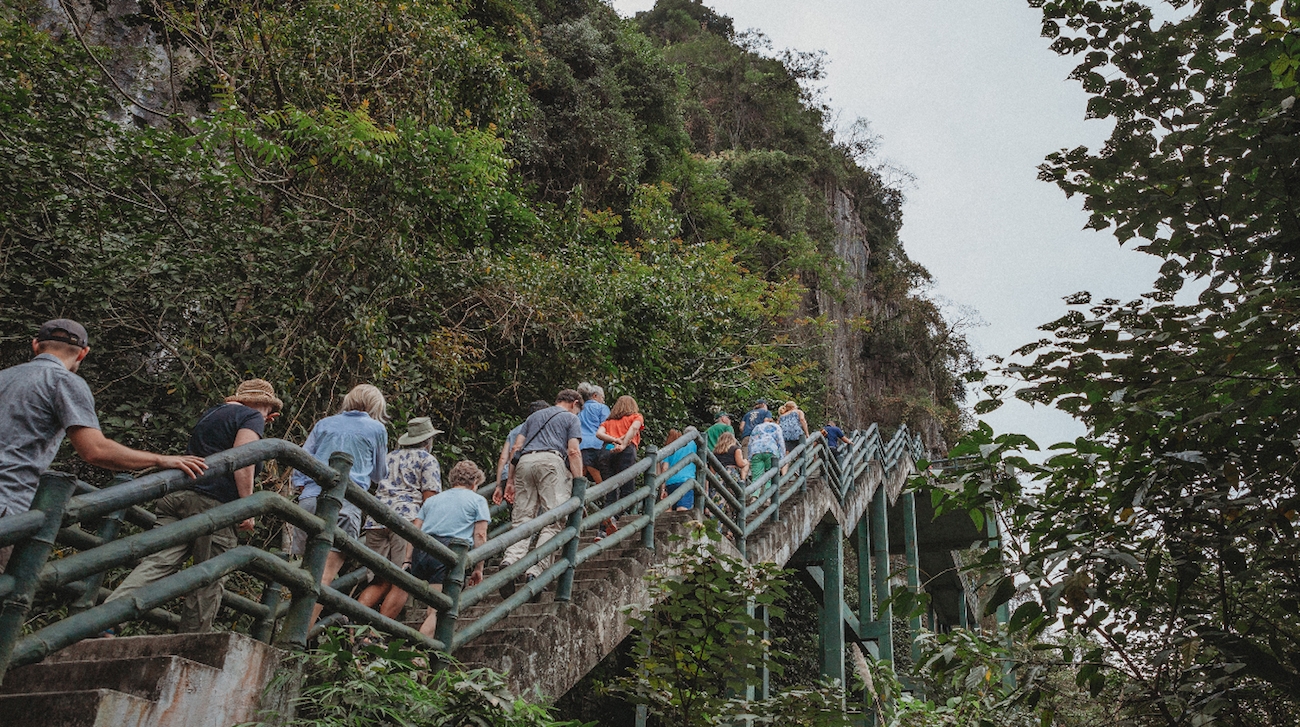 Outdoor staircase in Vietnam, a group of tourists are climbing up it