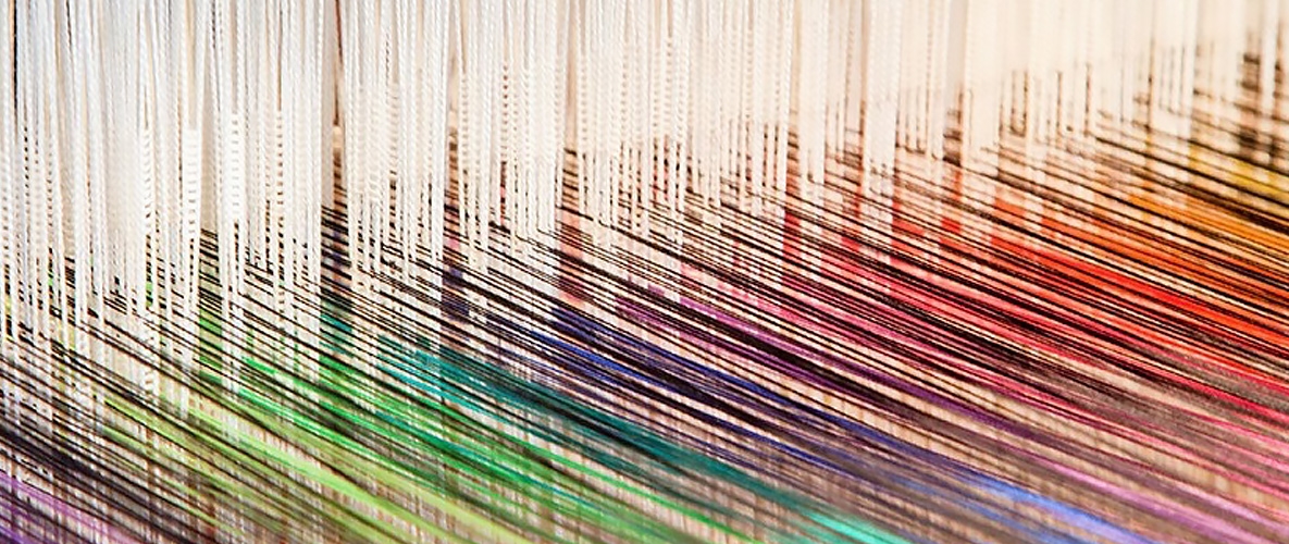 Extreme close up of yarn on a loom